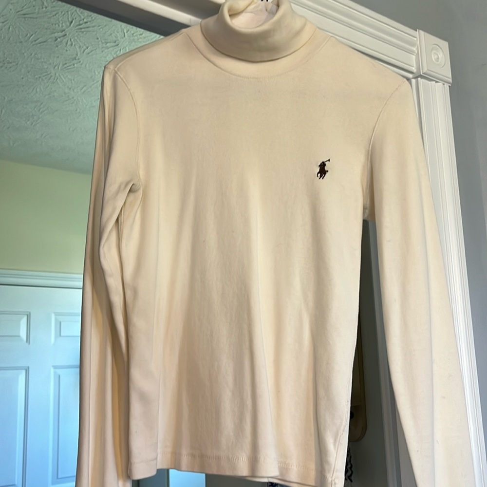 Polo women’s turtle neck. Size medium but fits like a small.